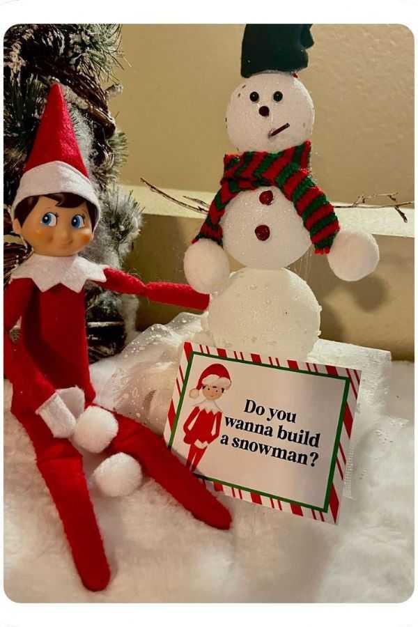 Elf Building a Snowman