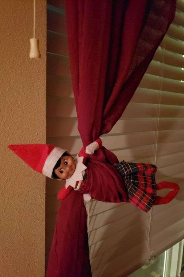 Elf Peeking from the Curtains